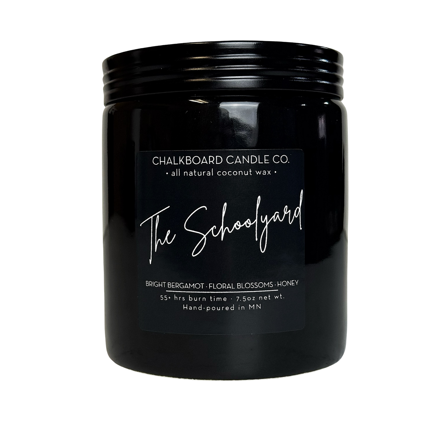 Black glass candle jar labeled The Schoolyard by Chalkboard Candle Co.; bright bergamot, floral, honey; hand-poured in MN